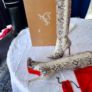 Christian Louboutin Snake skin tall boots brand new in a box
